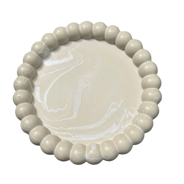 Vide-poche design rond en résine beige