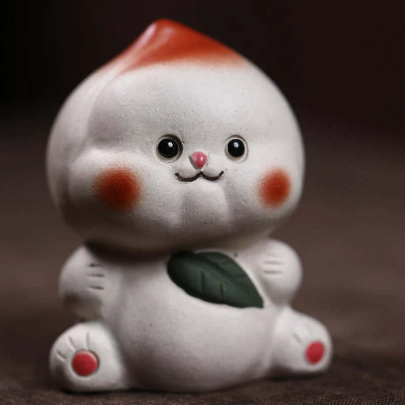 Mascottes de thé plum en argile