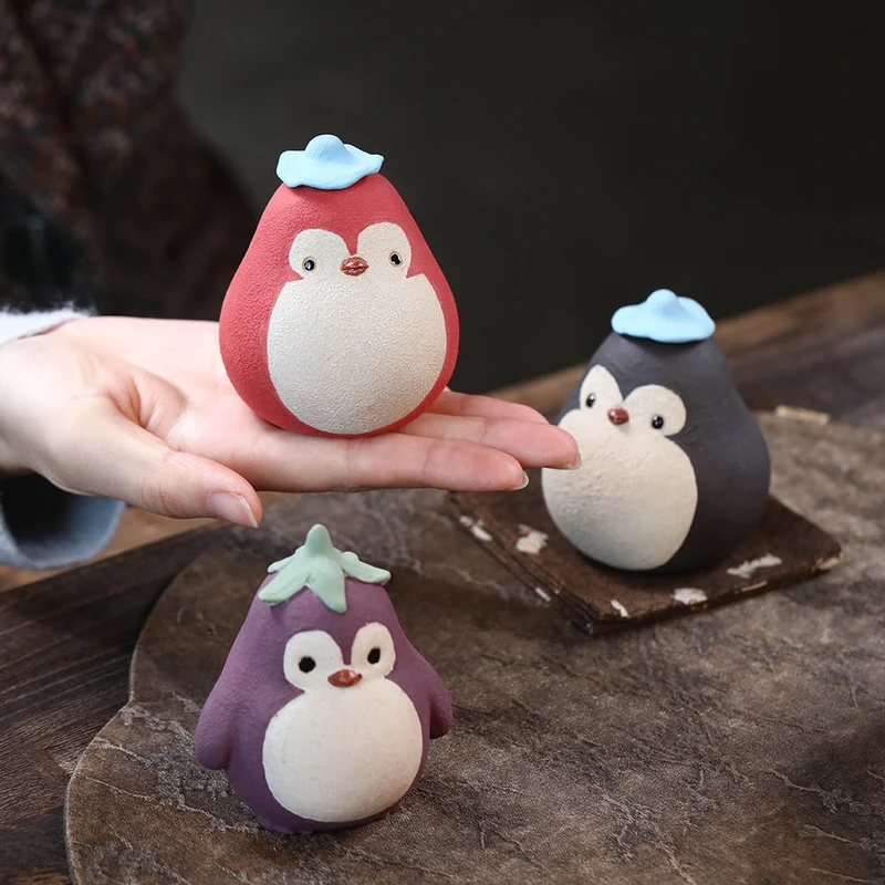 Mascottes de thé pinguin en argile