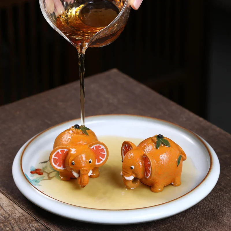 Mascottes de thé elephant orange en argile