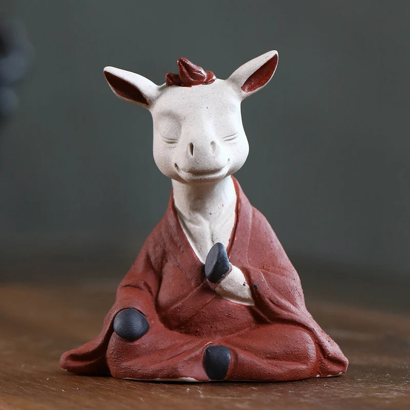 Mascottes de thé vache zen en argile